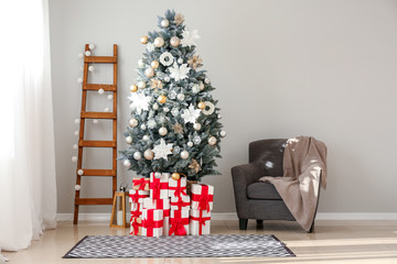 Interior of room with decorated Christmas tree