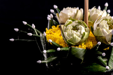 Krathong banana leaf decorated with flowers and joss sticks, candles. Ancient thai traditions