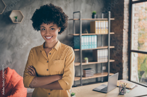 Portrait of cool afro american girl start-up representative agent cross hands ready decide workforce solution in enterprise office loft