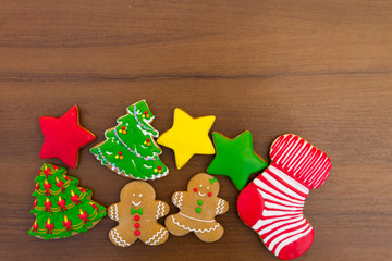 Wall Mural - Festive tasty Christmas cookies on wooden table. Top view