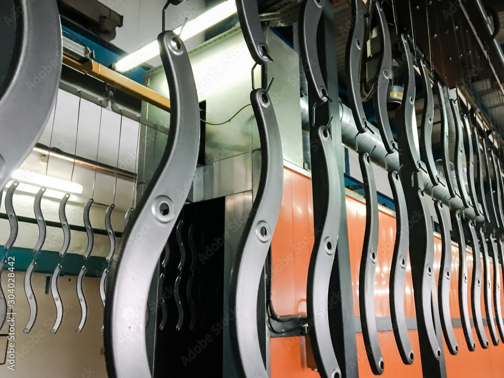 Powder coating line. Industrial interior. Workshop equipped with ...