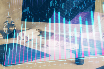 Financial market graph hologram and personal computer on background. Double exposure. Concept of forex.