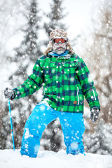 Man traveler hiking in winter in stormy snow weather. Active healthy lifestyle concept