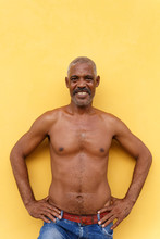 Mature Cuban In Front Of A Yellow Wall , Trinidad - Cuba