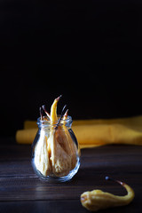 Dried pears on a dark wooden background. Fruit chips.