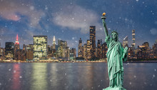 Statue Of Liberty In Front Of Manhattan Skyline At Night With Snow