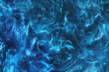 Wall Mural - Abstract elegant, detailed blue glitter particles flow with shallow depth of field underwater. Holiday magic shimmering underwater space luxury background. Festive sparkles and lights. de-focused.