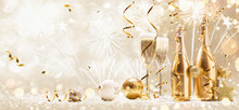 New Years Eve Celebration Background With Champagne And Confetti. Golden Holiday Party