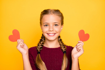 Sticker - Close-up portrait of her she nice attractive lovely sweet cute cheerful cheery pre-teen girl holding in hands small heart cards isolated on bright vivid shine vibrant yellow color background