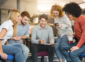 Wall Mural - Group of young colleagues discussing new marketing strategy