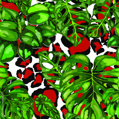 Seamless pattern with tropical leaves on leopard spots. Beautiful allover pri...