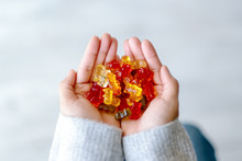 Top View Image Of A Woman Holding Colorful Jelly Gum In Hands