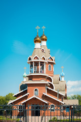 Wall Mural - Modern wooden Church of the Christian Orthodox religion in the village in Russia