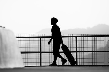 Wall Mural - Silhouette of a skateboarder dragging his skateboard