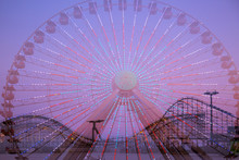 Amusement Park Rides, Double Exposure. Ferris Wheel And Roller Coaster