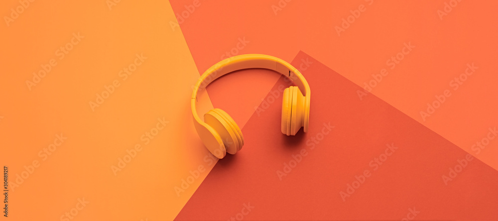 Minimal fashion, Trendy coral neon headphones. Music vibration on geometry background. Hipster DJ accessory Flat lay. Art creative summer vibes, fashionable pop art style. Bright neon color, banner - obrazy, fototapety, plakaty 