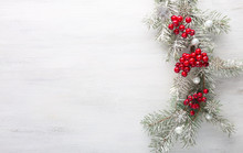 Fir Branch With Christmas Decoration On White Shabby Wooden Board.  Christmas Background With Copy Space For Text. Flat Lay.