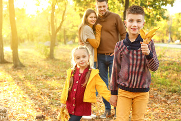 Poster - Happy children with parents resting in autumn park