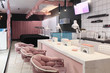 Interior of luxury stylish beauty salon.First plan pink armchairs and table for manicure and second plan place for eyelash extension .Pink concept design.