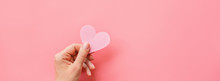 Valentine's Day Background. Female Hands Holding Pink Hearth. Flat Lay, Top View, Mockup, Template, Copy Space. Minimal Abstract Composition For 14 February Celebration