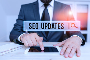 Wall Mural - conceptual hand writing showing seo updates. concept meaning new information or design in search eng