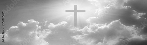 Fotografía Christian cross appeared bright in the sky with soft fluffy clouds, white, beautiful colors