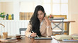 © Prathankarnpap - Editor book with using her tablet and stylus pen.