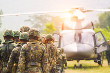 Soldiers Boarding A Military Helicopter , Soldiers Preparing Training Exercise.