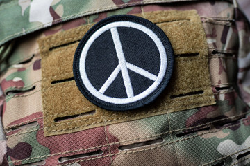 velcro peace sign on camouflage backpack