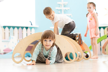 Wall Mural - Children play in playroom or daycare centre