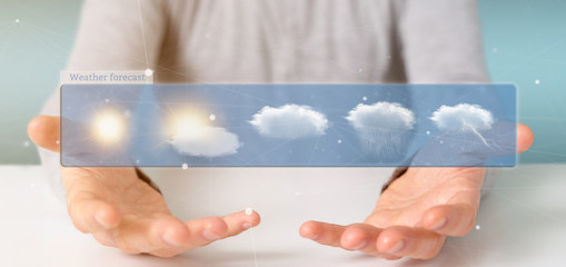 Wall Mural - businessman holding a weather forecast widget 3d rendering