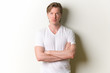 © Ranta Images - Portrait of young handsome man with arms crossed