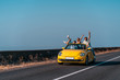 © Artem - The friends travel by a cabriolet