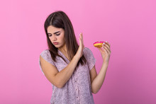 Woman On Dieting For Good Health Concept. Close Up Female Using Hand Push Out Her Favourite Donut For Good Health. Diet, Dieting Concept. Junk Food, Slimming, Weight Loss