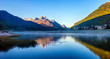 © nikitos77 - Mountain lake panorama with mountains reflection. Idyllic look. Autumn forest. Silvaplana Lake, Switzerland
