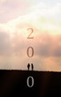 Concept new year 2020. Silhouette two young women traveling into the new year 2020. Minimalist style.