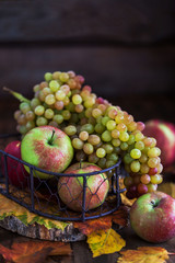 Fresh autumn apples and grapes