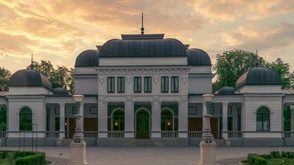 Wall Mural - Cluj-Napoca, Romania: Timelapse of the famous Cluj-Napoca Casino. Cluj-Napoca Historical Landmark Casino timelapse at sunrise in Romania. Cluj Napoca Casino time lapse