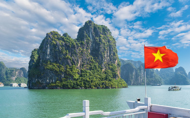 Wall Mural - landscape with halong bay and vietnamese flag, vietnam