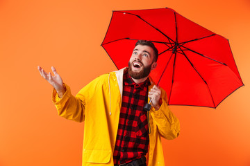 Sticker - Handsome bearded man in yellow raincoat