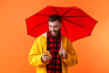 Sticker - Handsome bearded man in yellow raincoat