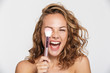 © Drobot Dean - Image of delighted half-naked woman making fun with makeup brush