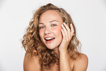 Canvas Print - Image of happy half-naked woman smiling and looking at camera