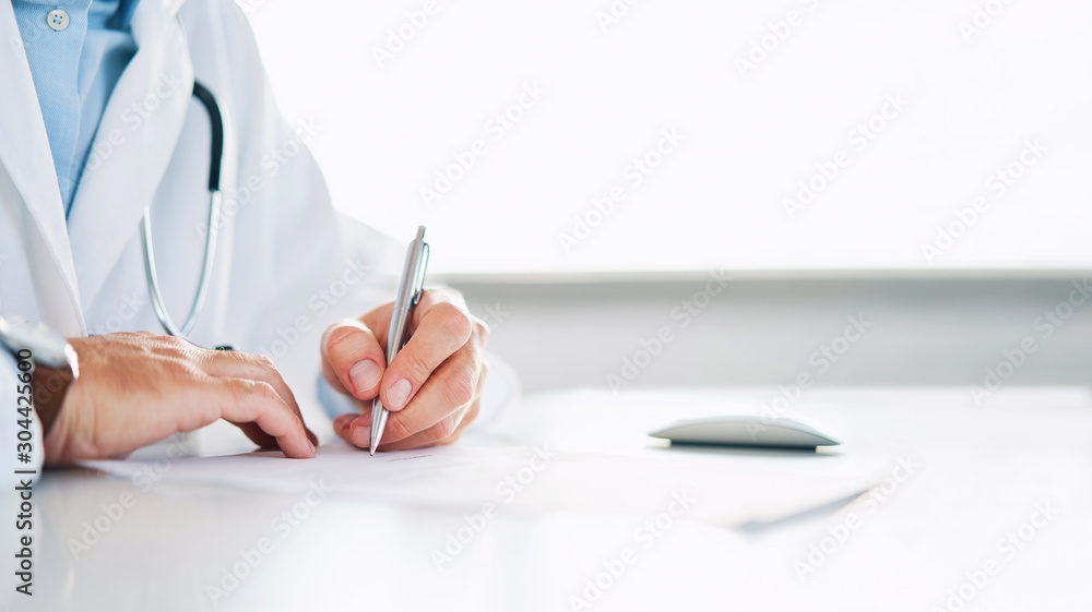Close up of doctor signing prescription for patient - obrazy, fototapety, plakaty 