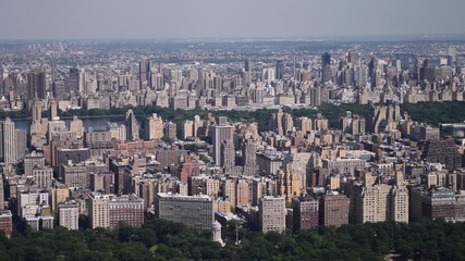 Wall Mural - Aerial view of New York City in slow motion. Central Park and Midtown skyline in Manhattan as seen from helicopter