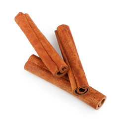 Wall Mural - Cinnamon sticks isolated on white background. Top view