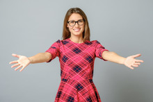 Woman smiling with open arms for hug