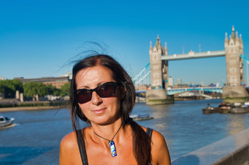 Sticker - Handsome woman happy visiting London with Tower Bridge in the background