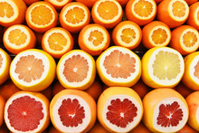 Different Types Of Citrus Oranges, Grapefruits And Pomelo Cut. Natural Background Of Citrus Slices.