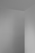 White Wall Corner With Straight Angle, Lighted With A Soft Natural Light Rendering A Nice Shade Of Grey